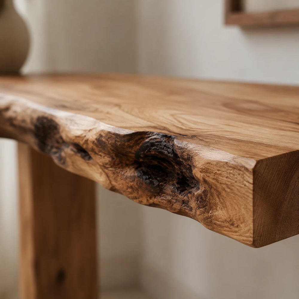 Close-up of a live-edge console table showing a natural knot in the grain