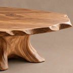 Artisan Round Coffee Table With Carved Trunk Base For Living Room