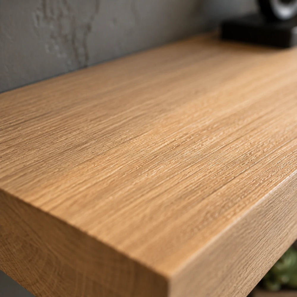 Macro close-up of the grain on the top face of a solid wood floating shelf