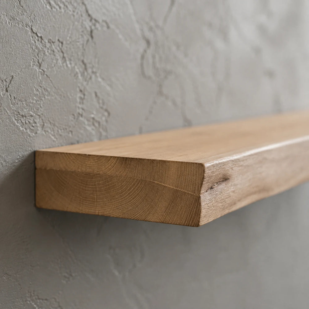Side profile of a solid wood floating shelf showing its slim thickness and live edge